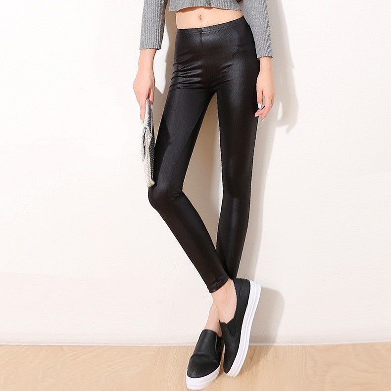 Faux leather pants, wearing thin leggings, black feet trousers